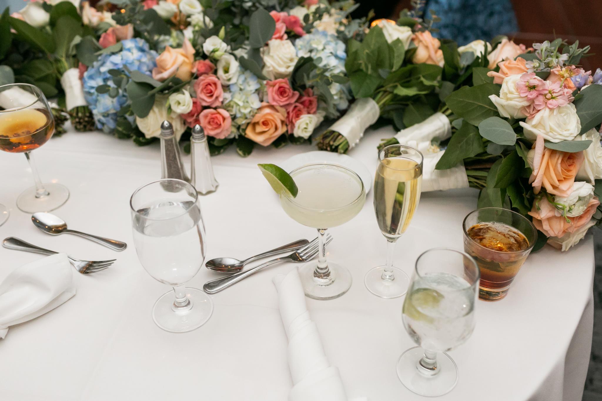 Wedding table setting with flowers and beverages
